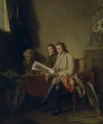 Portret van een man en een jongen die naar prenten kijken